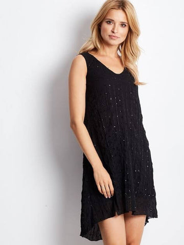 Black sequined dress with a tie at the back.